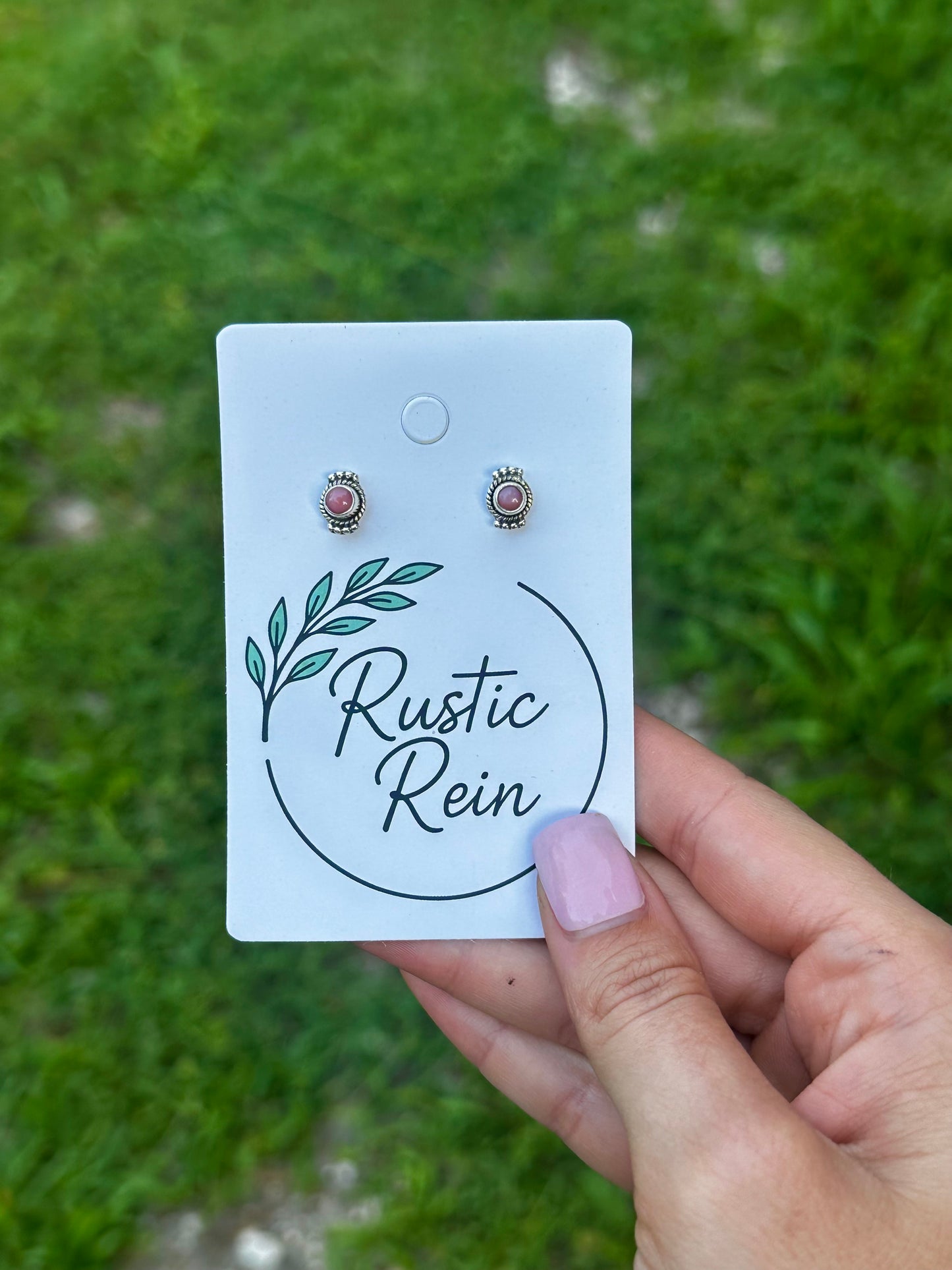 Pink conch stud earrings
