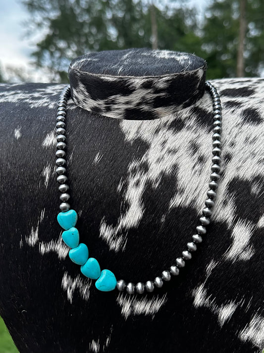 Off center heart necklace