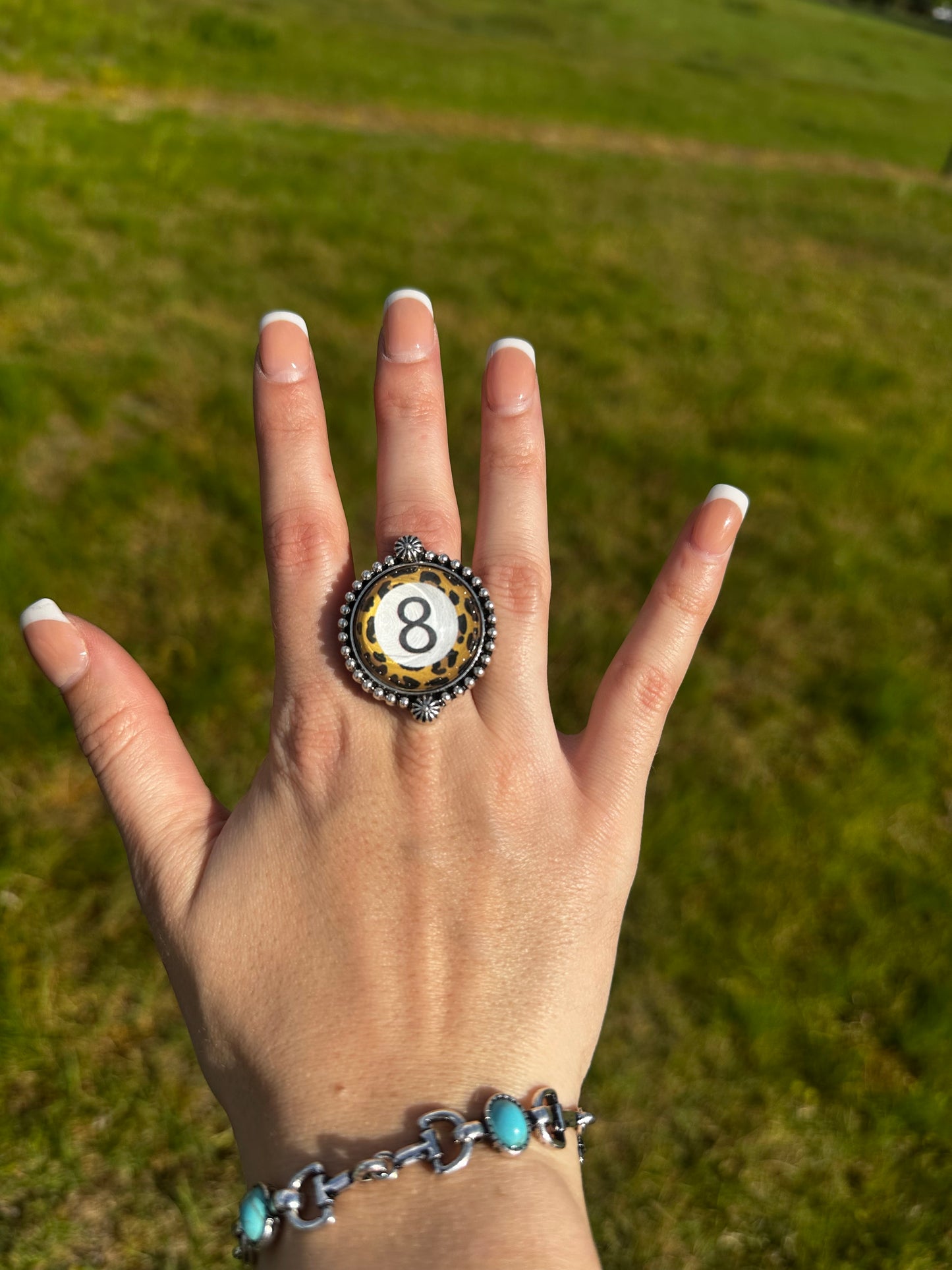 Adjustable cheetah 8 ball ring