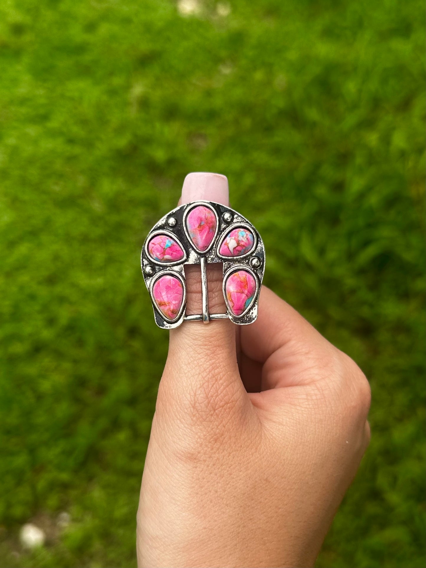 Adjustable pink buckle ring