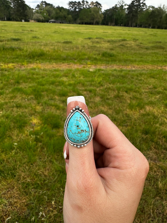 Adjustable tear drop ring