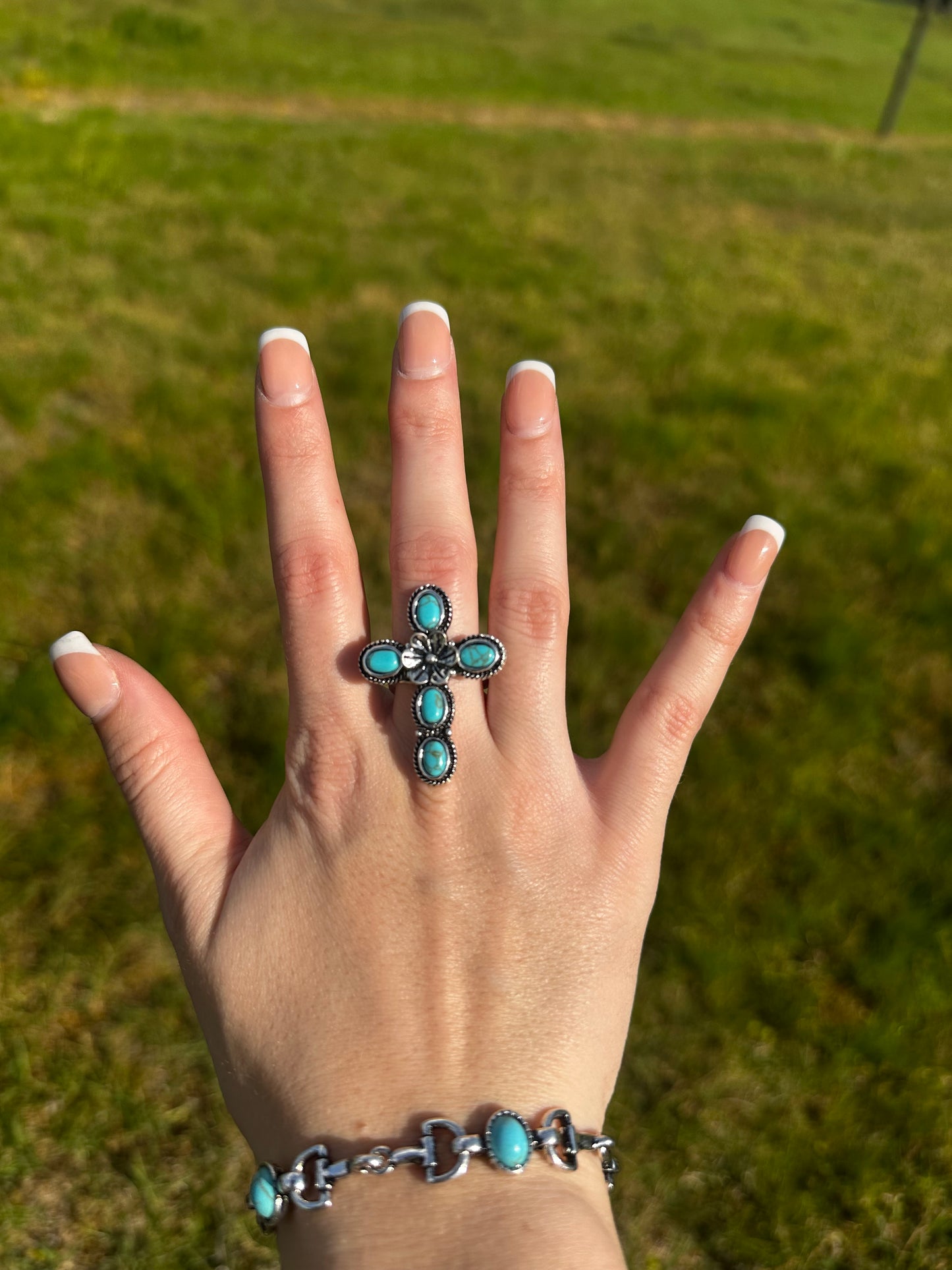 Adjustable cross flower ring