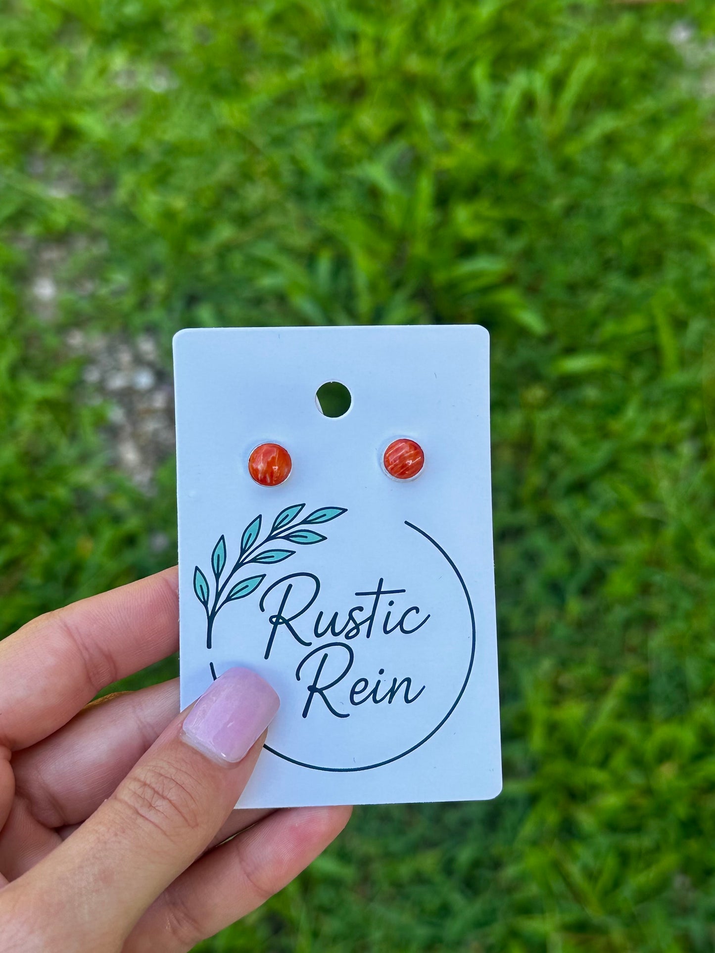 Orange spiny stud earrings ￼