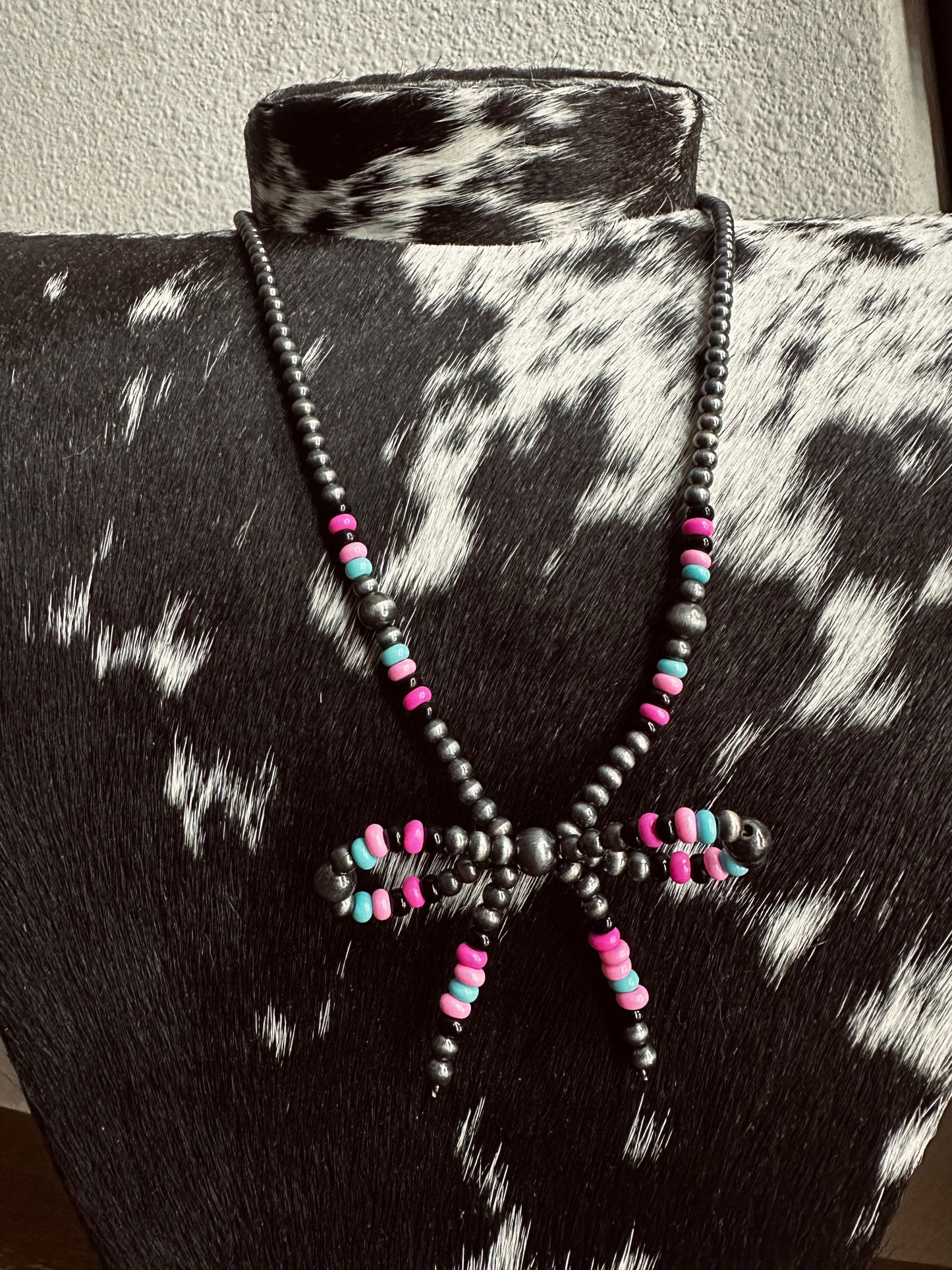 Pink bead bow tie necklace