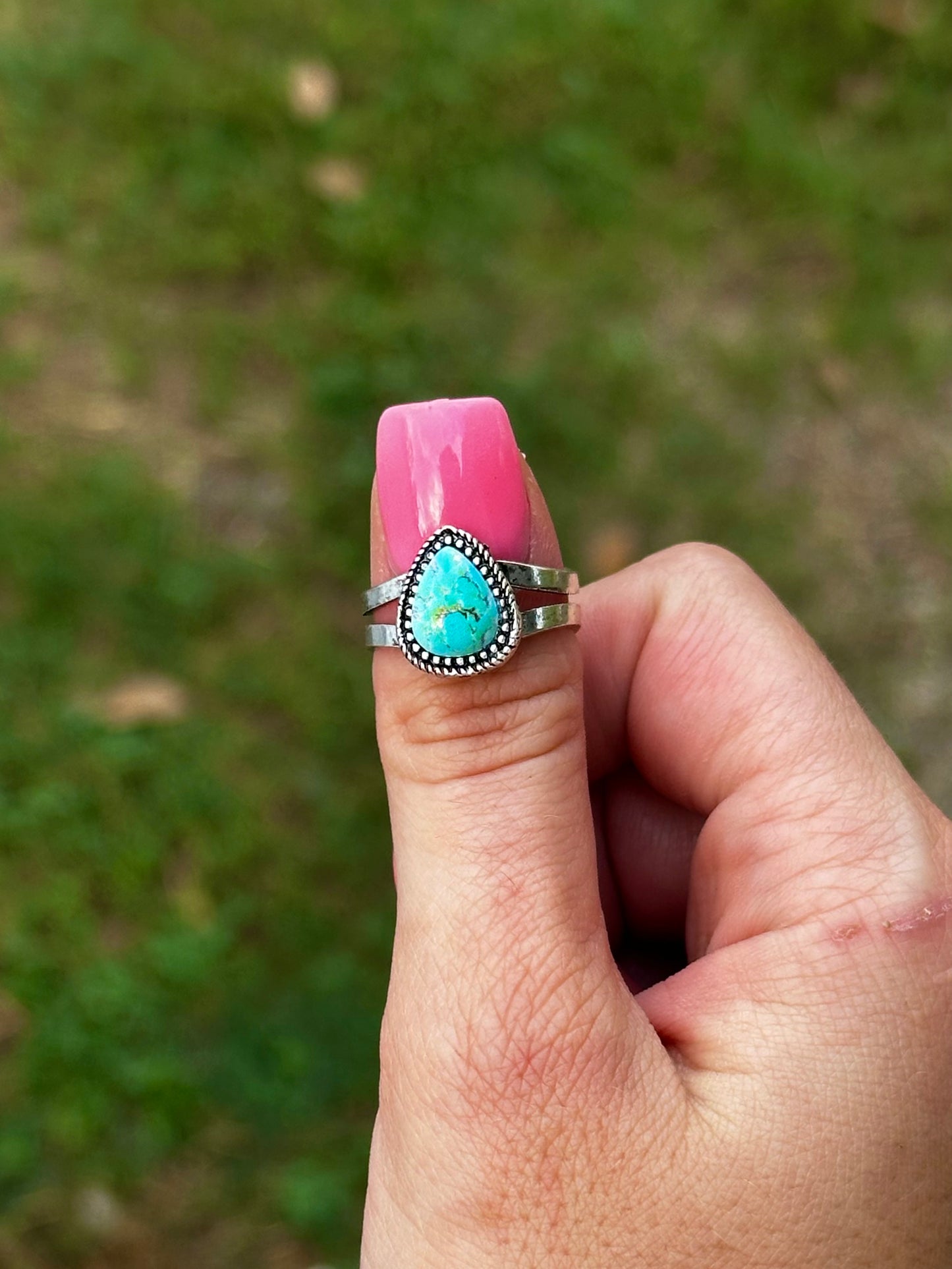 Adjustable tear drop ring