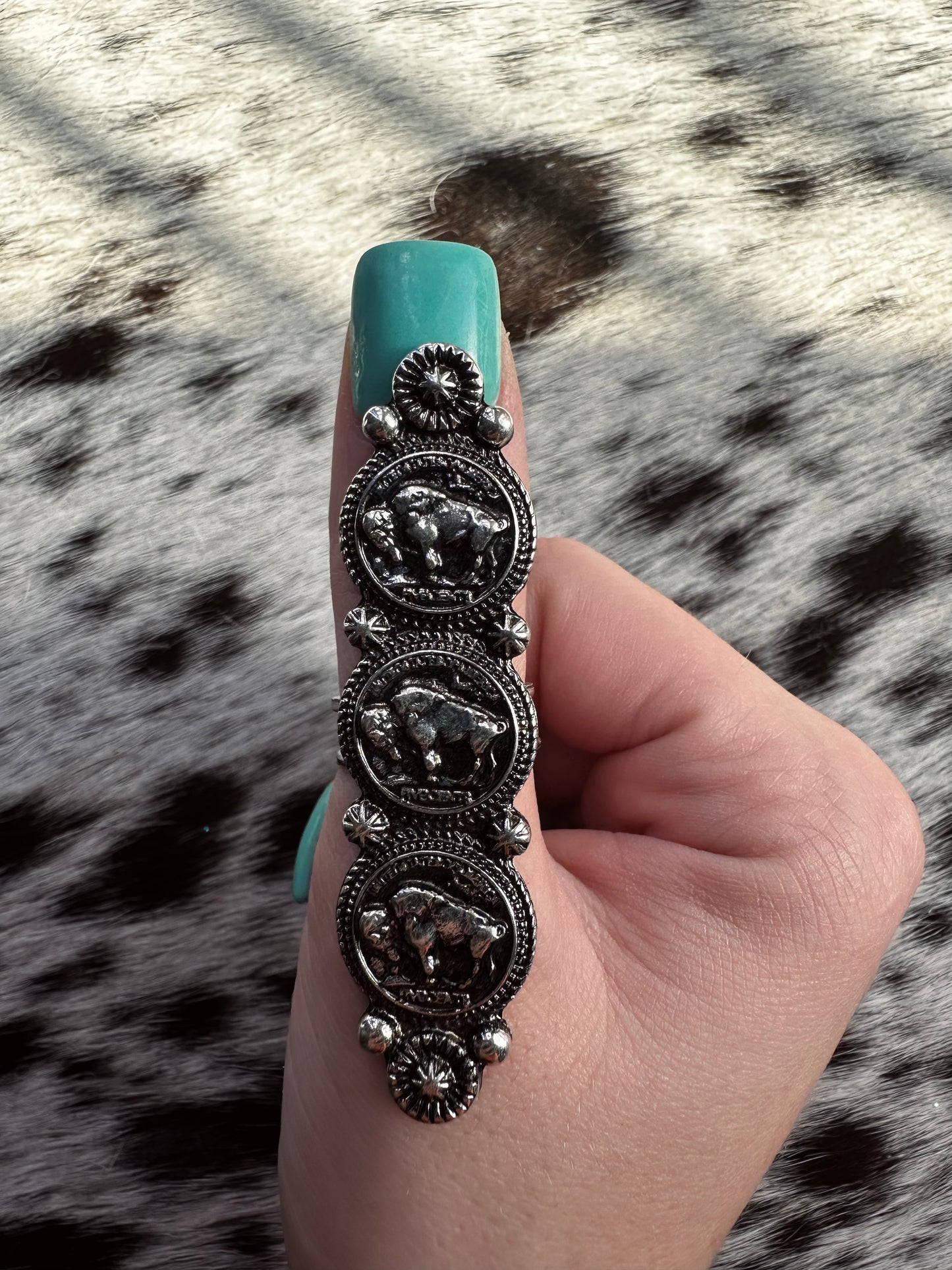 Adjustable triple buffalo ring