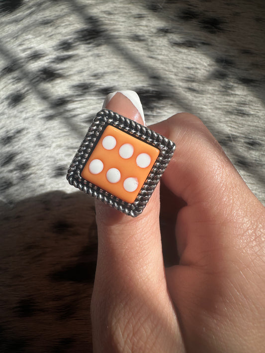 Adjustable orange dice ring
