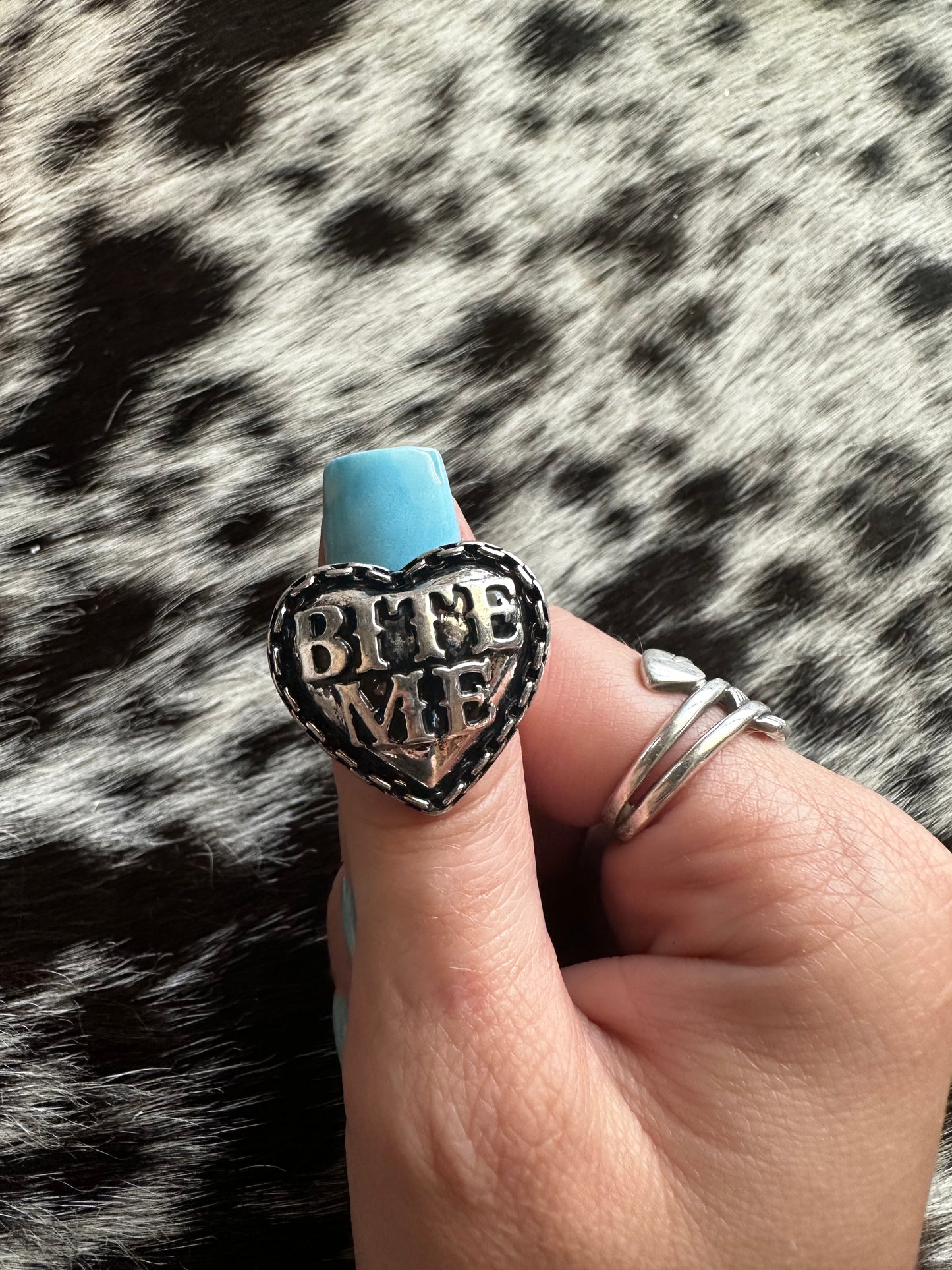 Adjustable bite me ring