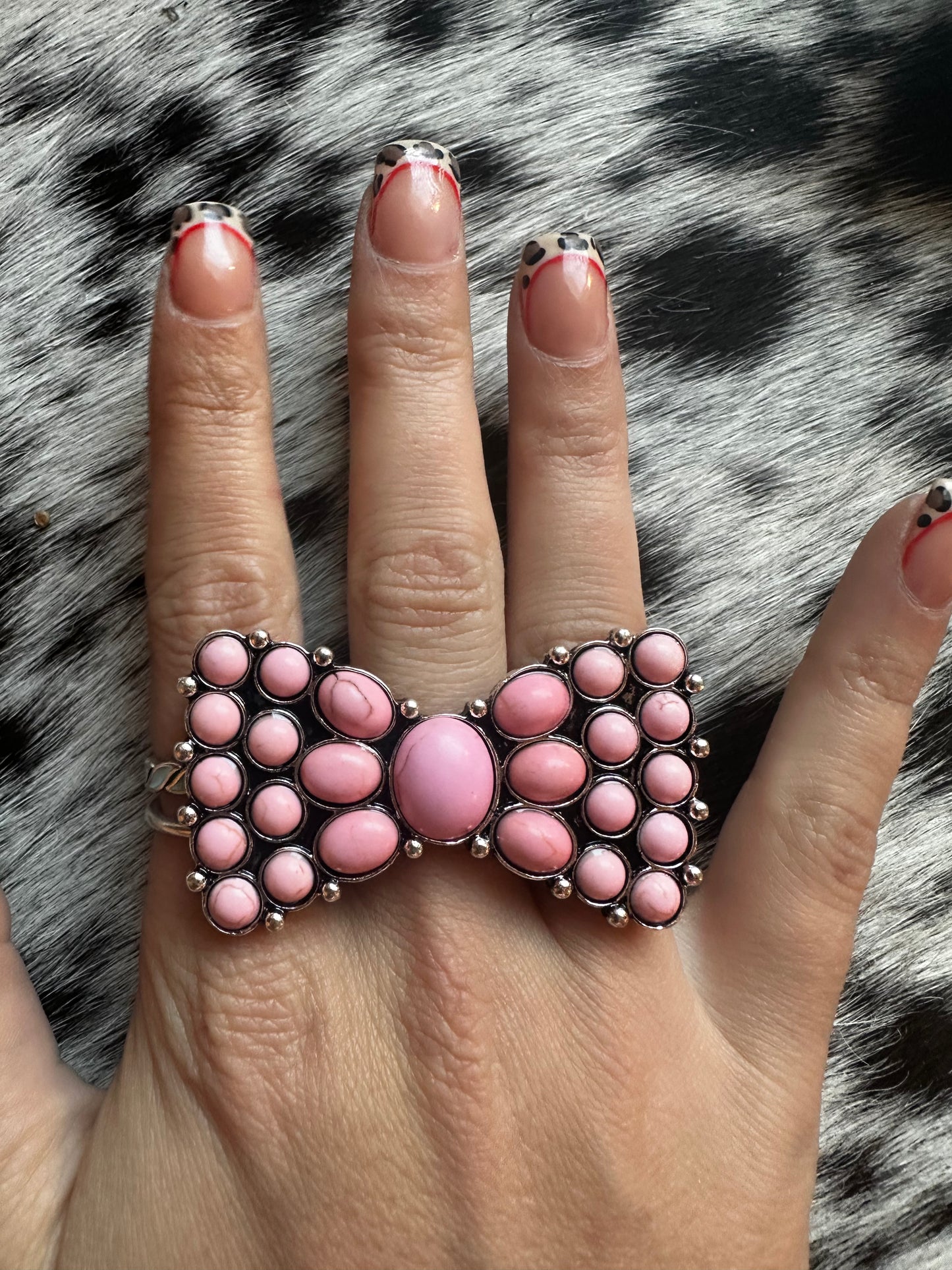 Adjustable pink bow ring