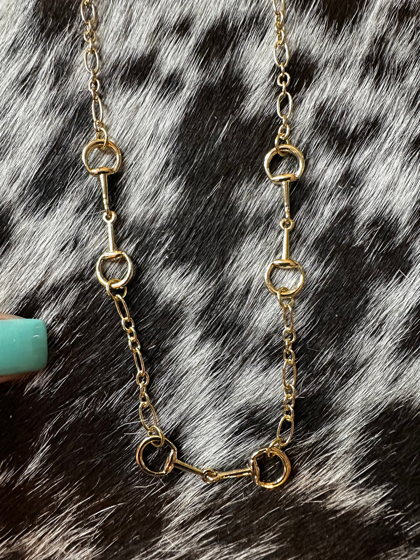 Triple gold color snaffle necklace
