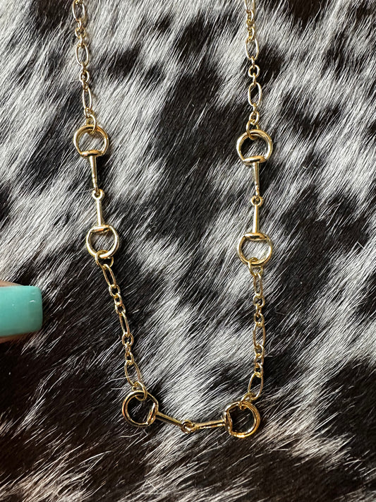 Triple gold color snaffle necklace